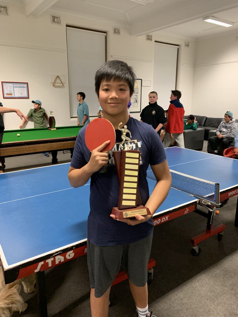 student-with-table-tennis-trophy